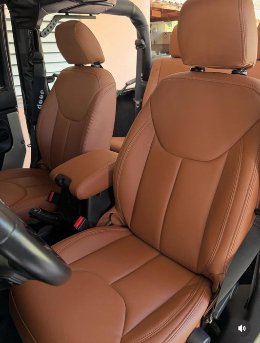 Front seats of Jeep Wrangler fitted with caramel artificial nappa leather seat covers showcasing smooth, tailored design and rich caramel color