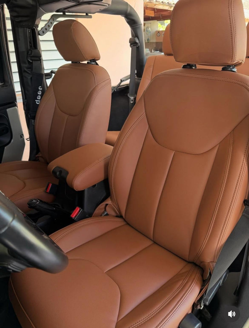 Front seats of Jeep Wrangler fitted with caramel artificial nappa leather seat covers showcasing smooth, tailored design and rich caramel color