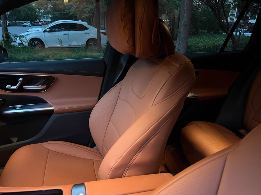 Close-up side view of brown artificial Nappa leather front seat cover in Mercedes Benz W205