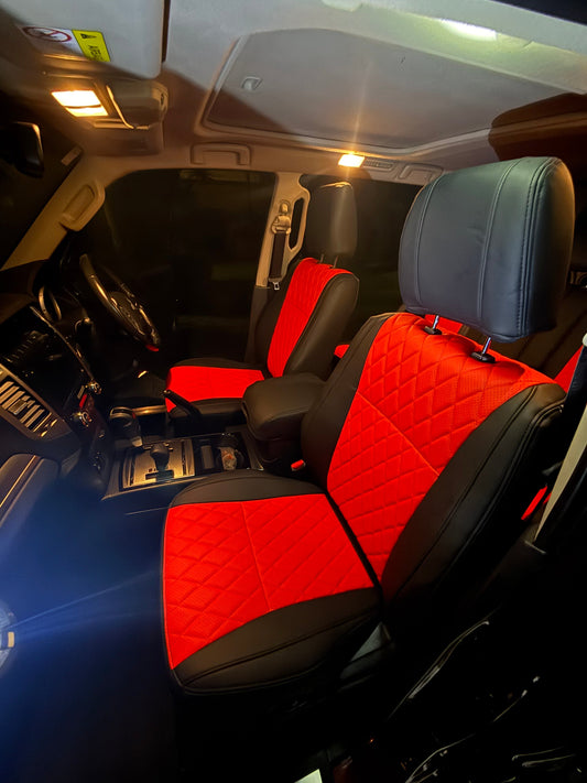 Front seats of Mitsubishi Pajero 2021 with custom red and black artificial Nappa leather seat covers in diamond quilting