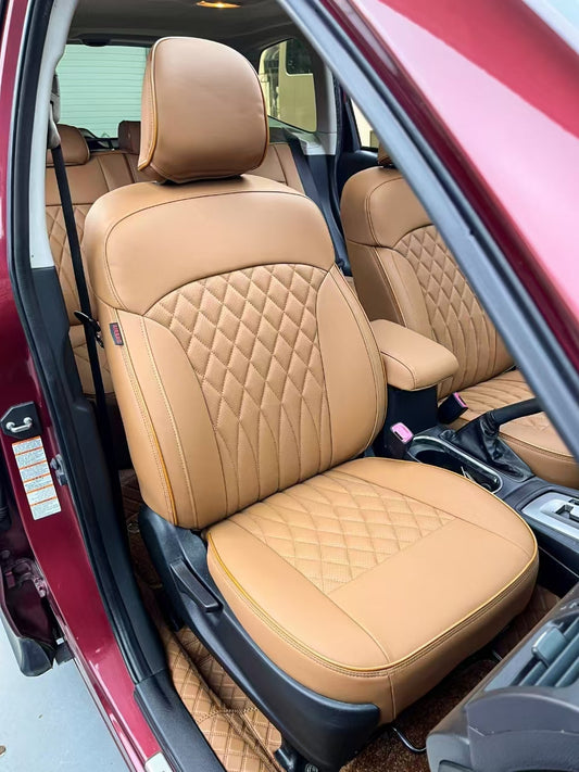 Close-up of light brown artificial nappa leather front seat cover with diamond quilting in Subaru Forester