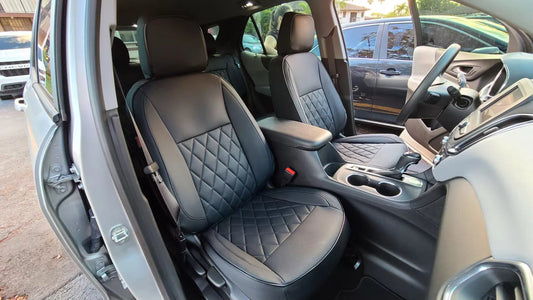 Front seats of Chevrolet Equinox 2021 with black custom Nappa leather seat covers showing diamond quilting