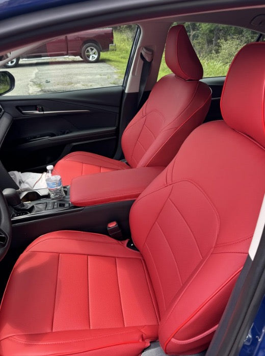 Front seats of 2025 Toyota Camry covered in custom red artificial Nappa leather seat covers