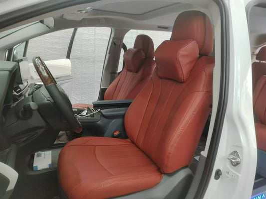 Front seats of Toyota Sienna with burgundy artificial Nappa leather seat covers