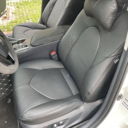 Front seat covered with custom dark gray artificial Nappa leather seat cover in a 2022 Toyota Camry, showing smooth texture and perfect fit