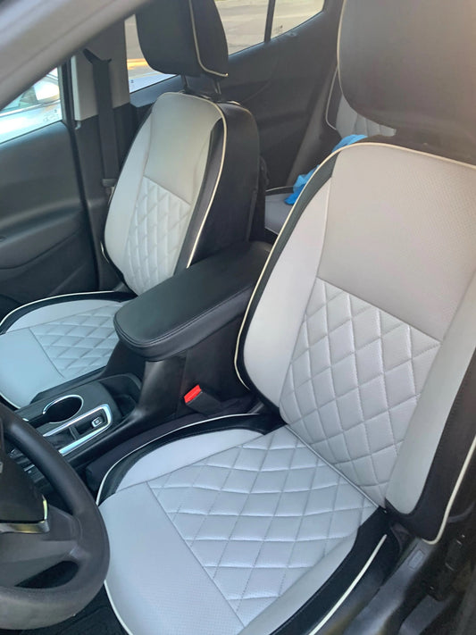 Front seats of 2021 Chevrolet Equinox with custom artificial Nappa leather seat covers in white and black with diamond quilting and piping