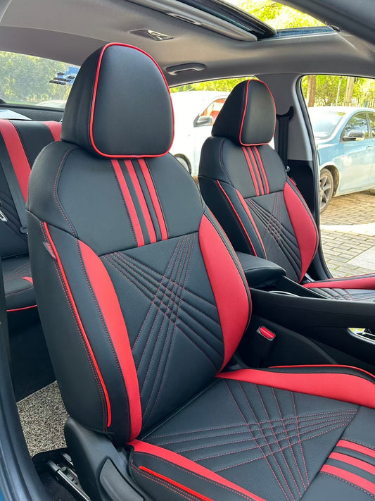 Front seats of Hyundai Elantra with black and red artificial Nappa leather seat covers featuring red stripes and detailed stitching