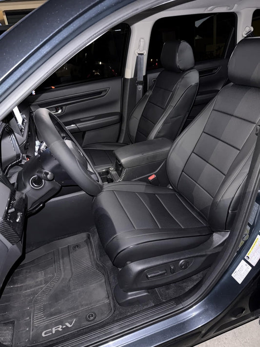 Front seats of Honda CR-V with custom black artificial Nappa leather seat covers showing perforated and smooth panels