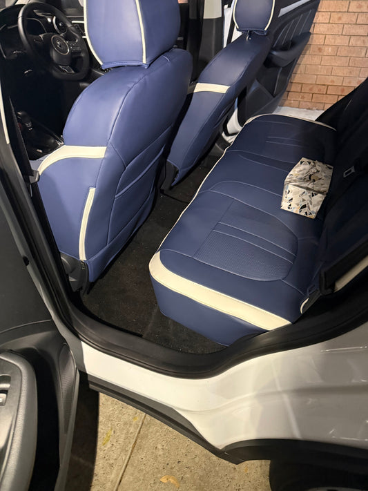 Rear seats of MG ZS 2024 fitted with custom blue and cream artificial nappa leather seat covers