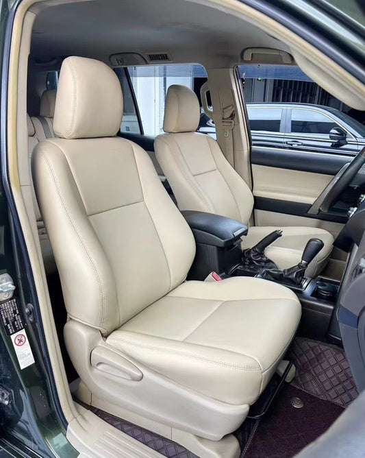 Front seats of Toyota Prado 2022 fitted with beige artificial nappa leather seat covers