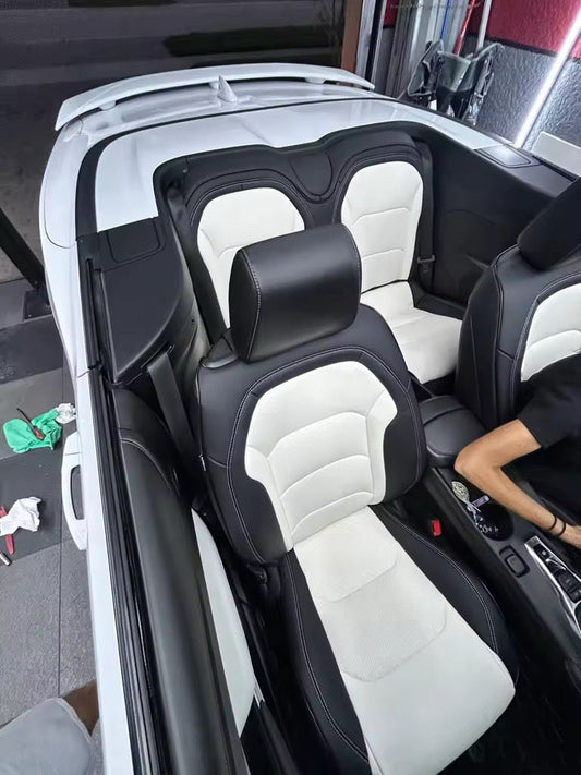Custom-fit artificial nappa leather seat covers in inner white and outer black on Camaro La Coupe 2022 front and rear seats