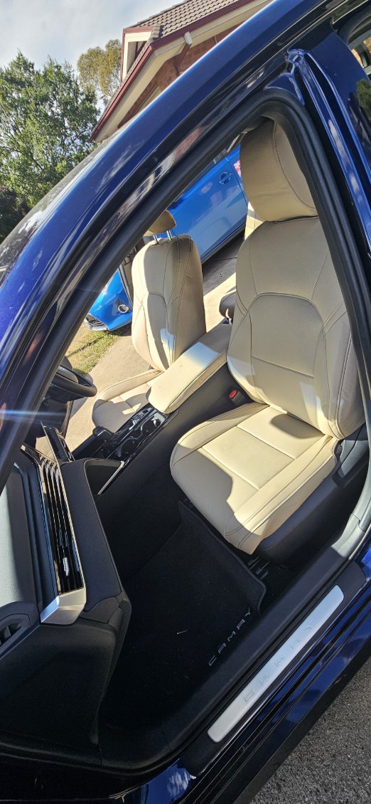 Beige artificial Nappa leather front seats in a 2025 Toyota Camry with precise custom fit