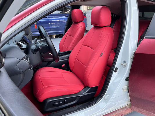 Front seats of Honda Civic covered in bright red artificial nappa leather seat covers with detailed stitching