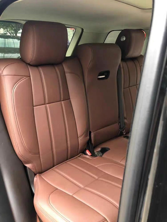 Rear seats of a Range Rover fitted with custom brown artificial Nappa leather seat covers