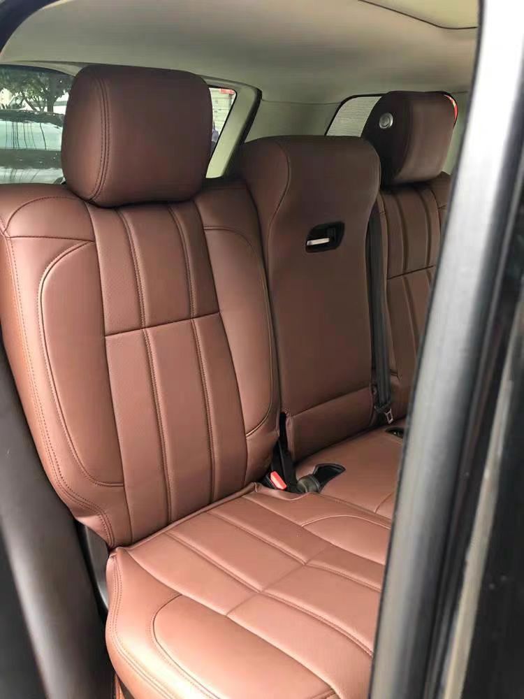 Rear seats of a Range Rover fitted with custom brown artificial Nappa leather seat covers