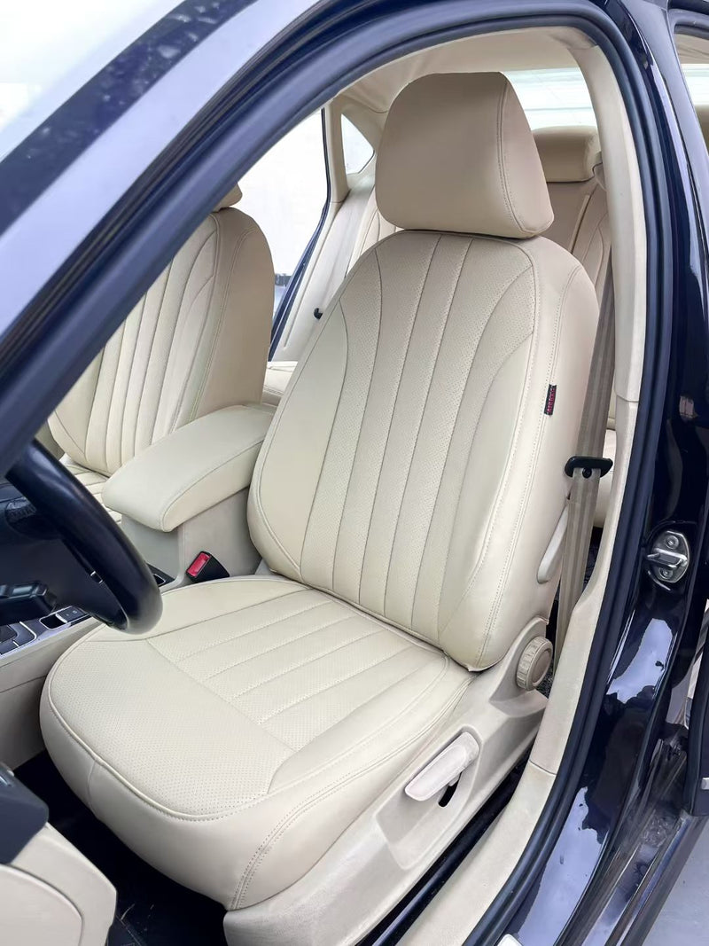 Front driver seat of Volkswagen Passat with cream artificial nappa leather cover featuring vertical stitching